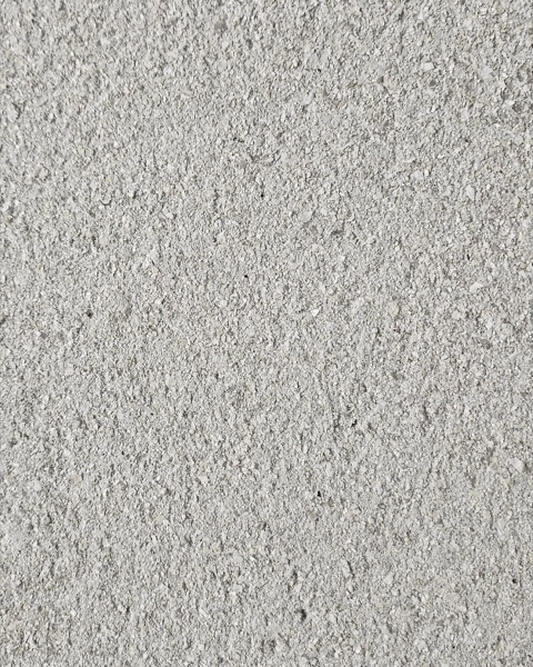 A textured render wall coating in a soft grey finish