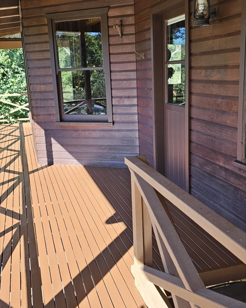 A timber exterior and deck freshly coated