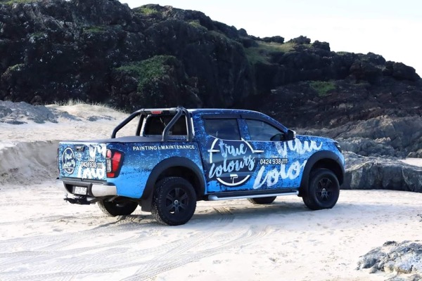 The branded True Colours Painting & Maintenance ute
