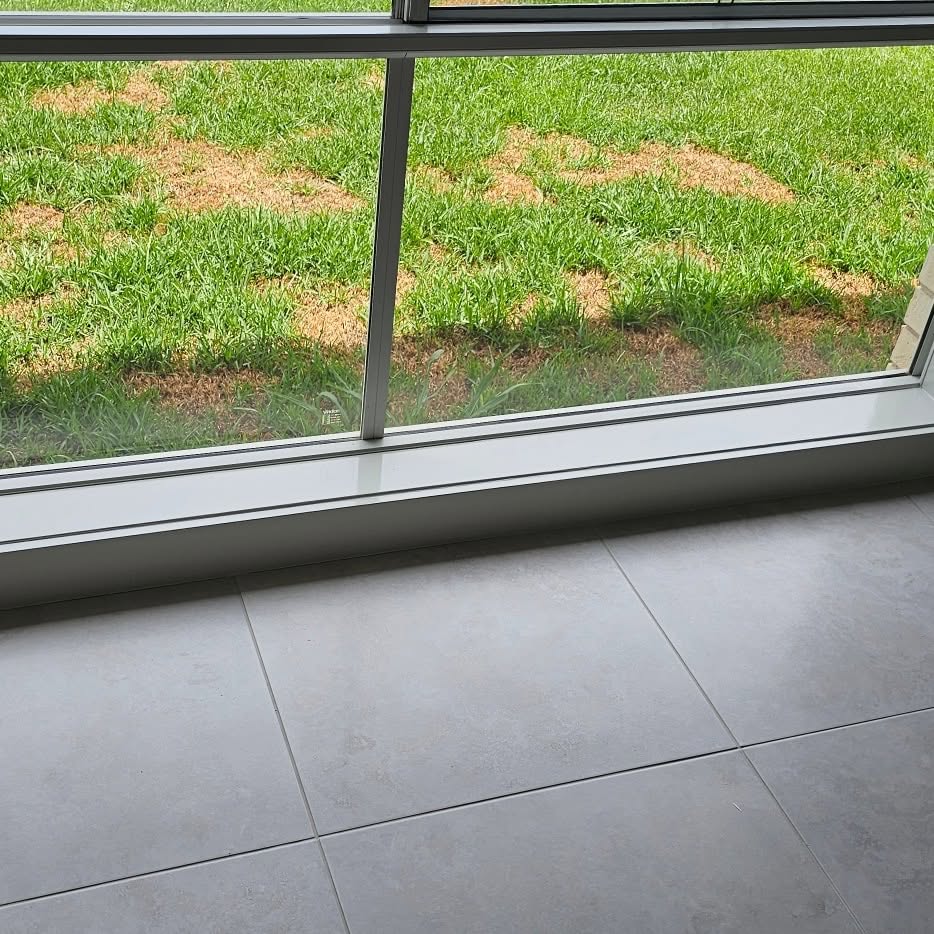 Freshly painted window sills and exterior trim