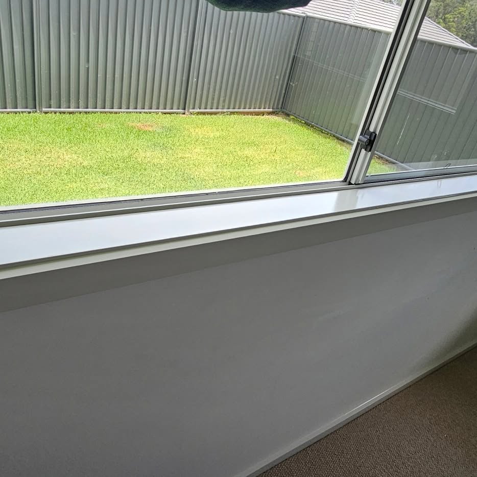 A painted fence and freshly finished eaves
